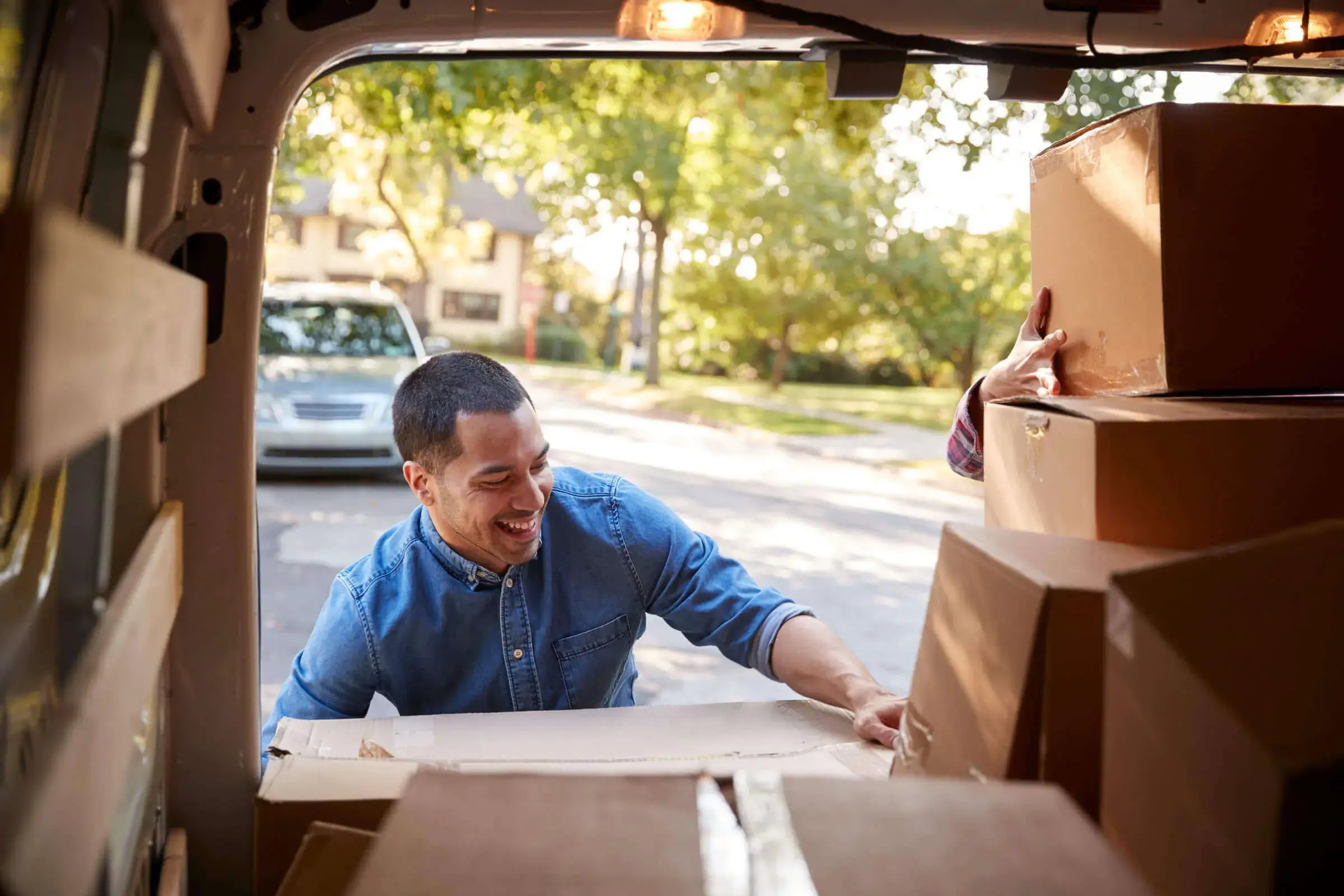 man loading up a luton van for rent