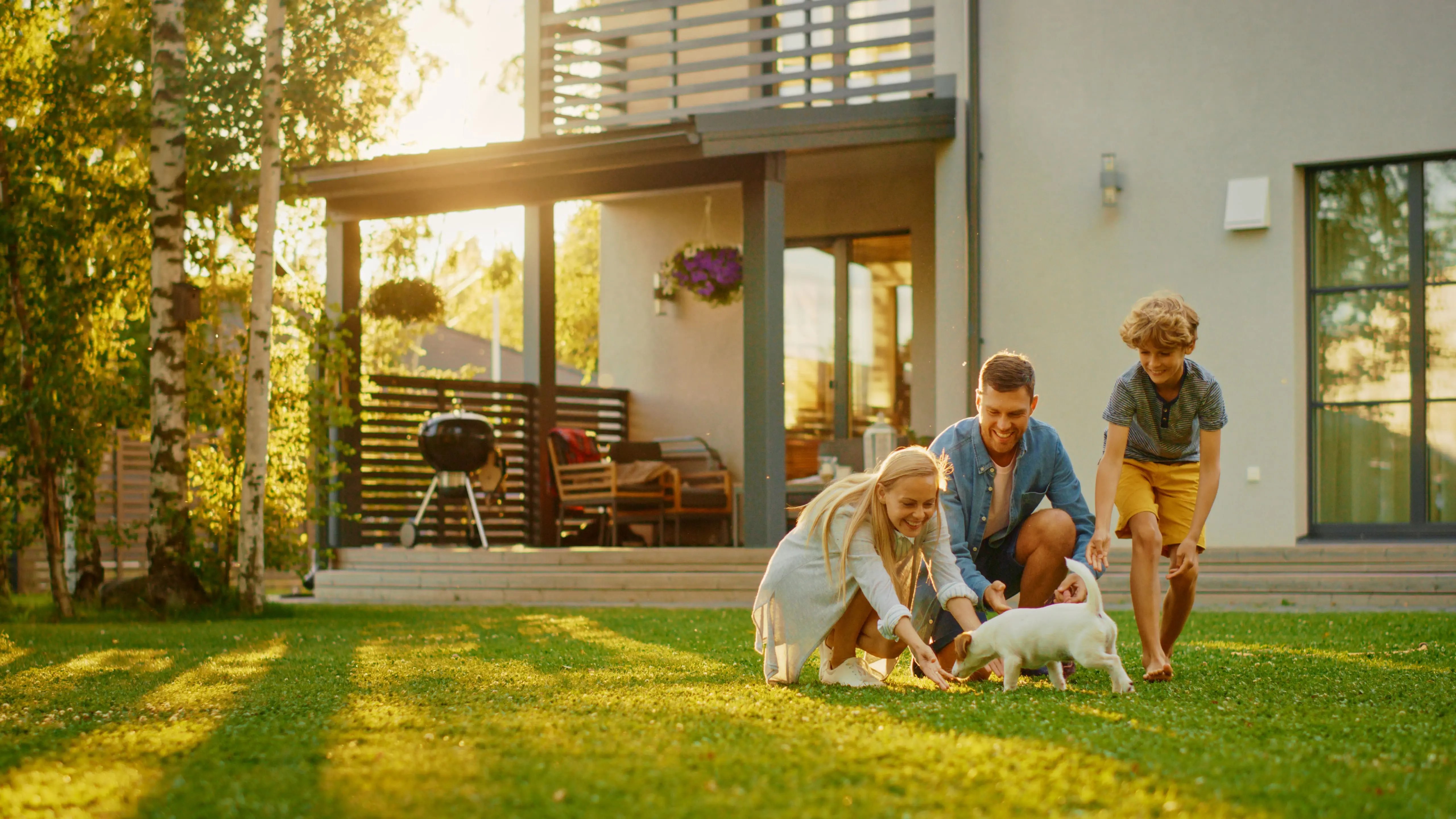 Happy family and dog enjoying complete garden renovation with hirefleet self drive van hire