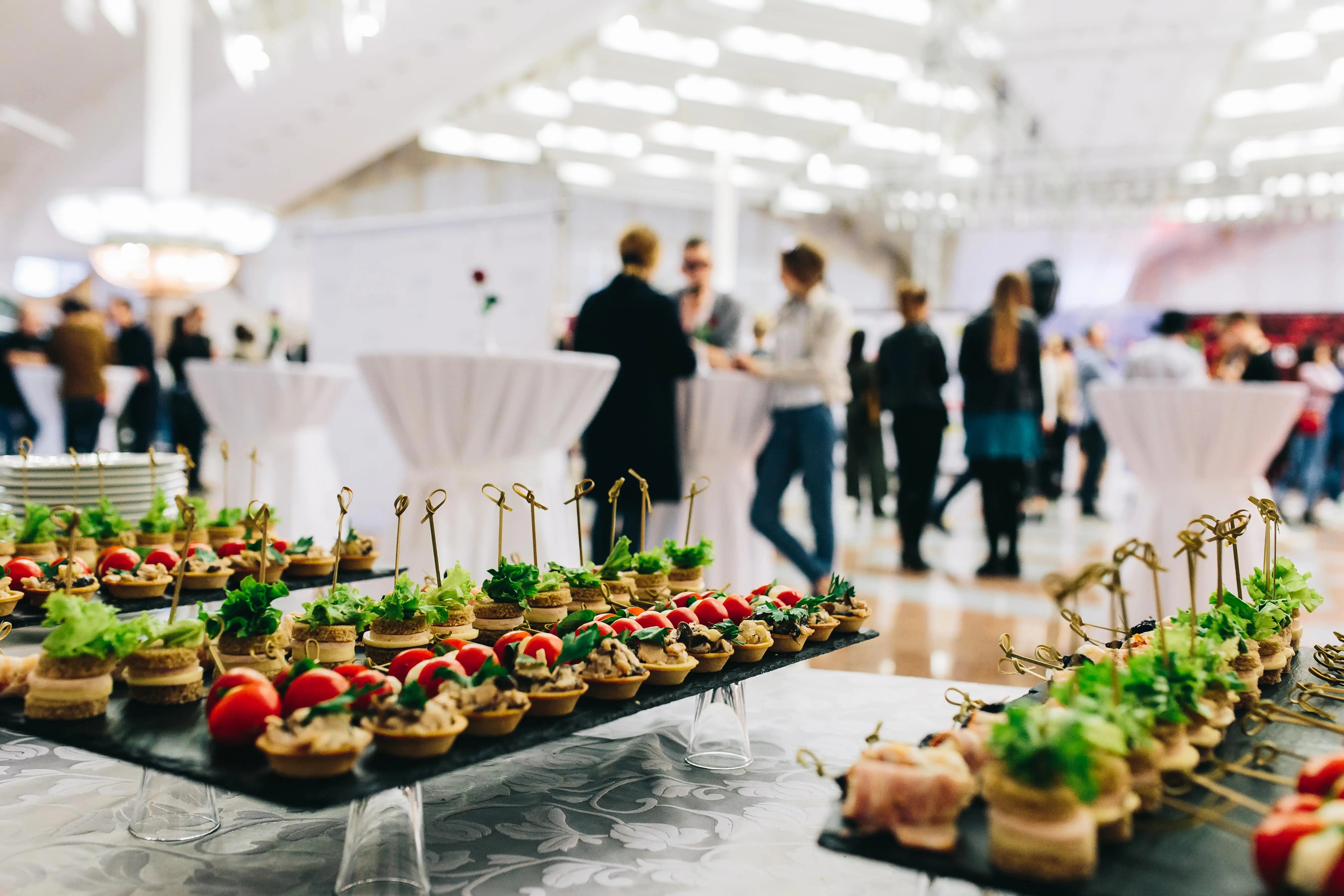 Food setup at a corporate event with a commercial van hire for caterers and decorators.