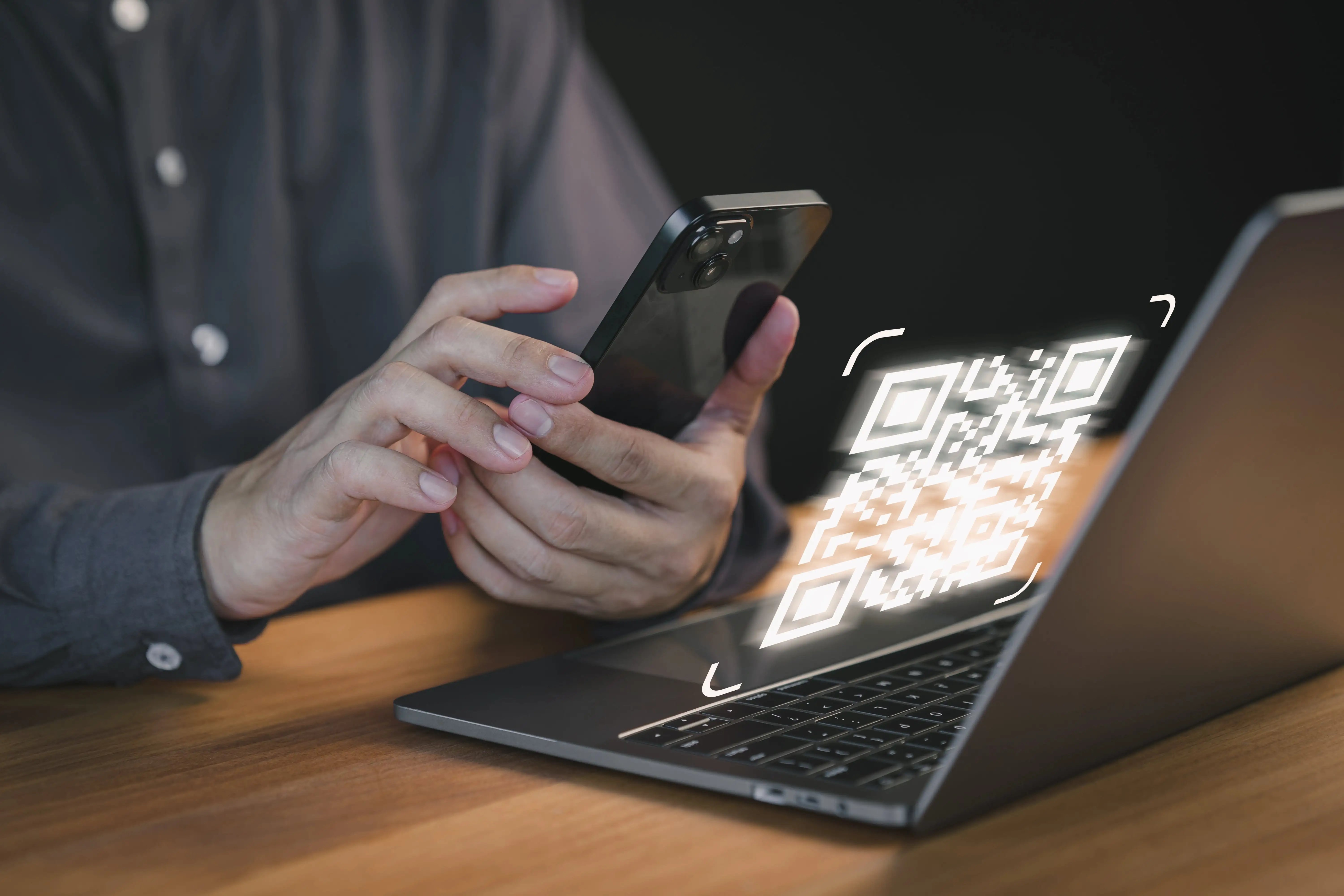 Customer scanning a DVLA check code from their laptop for a hirefleet self drive van hire.